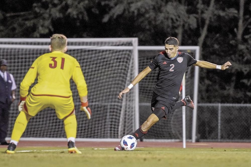 Sophomore forward Manny Perez shoots against No. 6 Louisville on Friday, Sept. 28 at Dail Soccer Stadium. The Wolfpack drew the Cardinals 2-2 after two overtime periods.