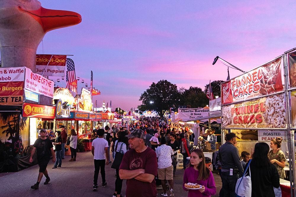 Fairgoers enjoy the food at the N.C. State Fair on Friday, Oct. 12. The fair was delayed last Thursday, Oct. 11 due to Hurricane Michael.