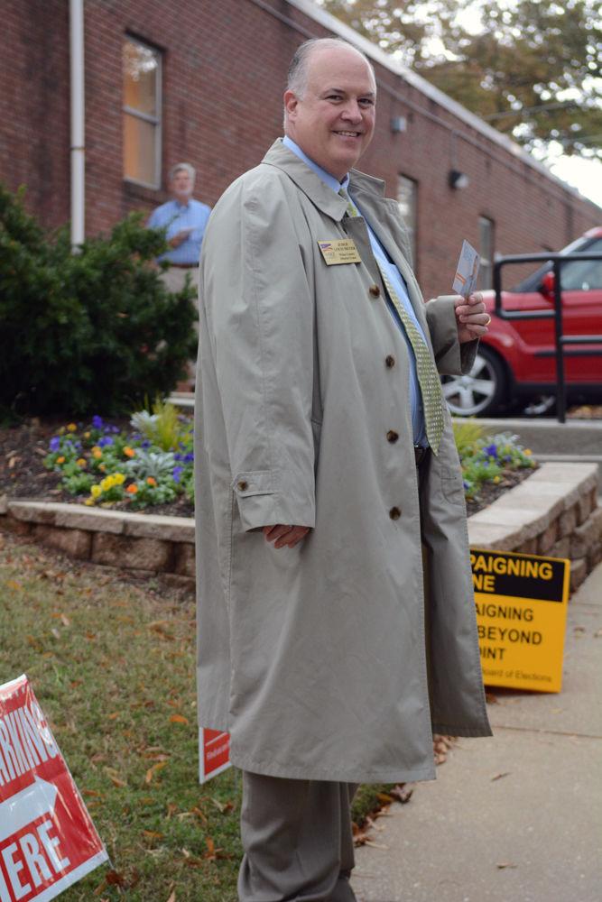 Democratic judge of the Wake County District Court, Louis B. Meyer, greets voters outside of the Pullen Park Community Center on Nov. 6.