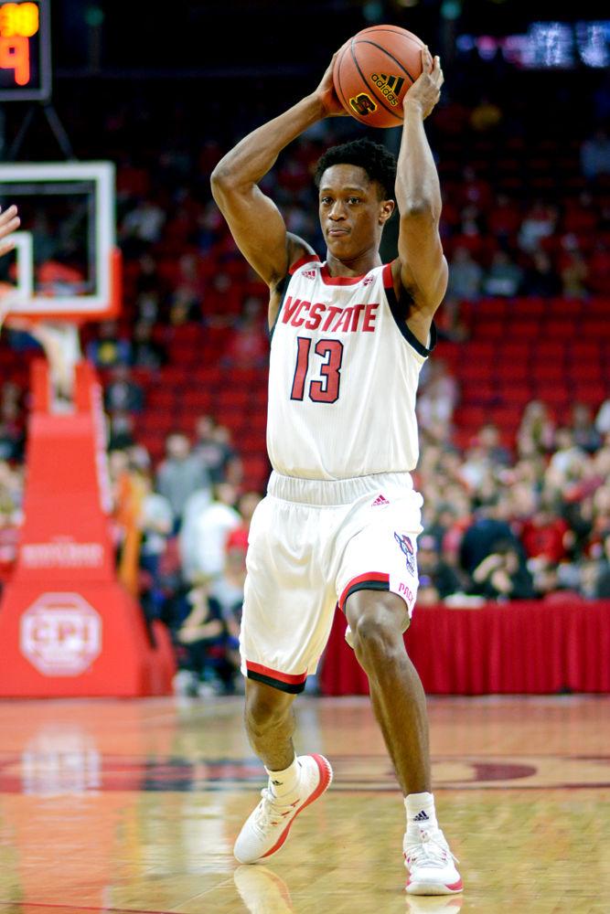 Redshirt junior guard C.J. Bryce gets ready to pass the ball against Maine on Saturday, Nov. 17 at PNC Arena. Bryce recorded 14 points and eight rebounds as the Wolfpack won 82-63&#160;