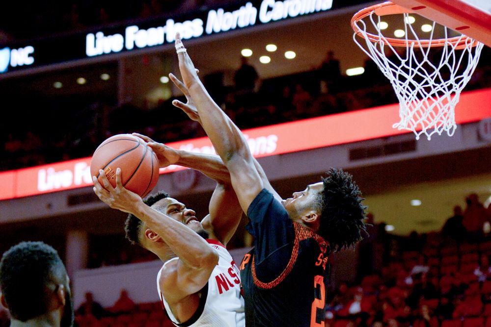 Redshirt senior guard Torin Dorn attacks the basket on Saturday, Nov. 24 at PNC Arena. Dorn scored 19 points on 7-15 shooting along with nine rebounds as the Wolfpack beat Mercer 78-74.