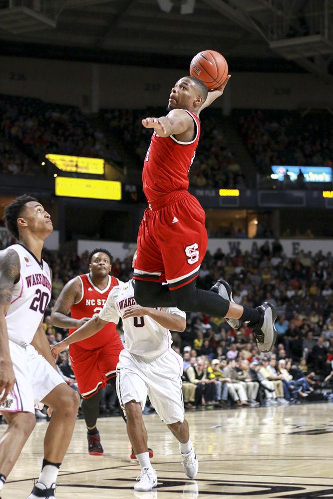 Freshman guard Dennis Smith Jr. throws down a windmill dunk during the Wolfpack's 88-58 loss to Wake Forest on Feb. 11, 2017.&#160; Smith made 7 of 13 shots from the field and had 17 total points in the loss at Lawrence Joel Veterans Memorial Coliseum.