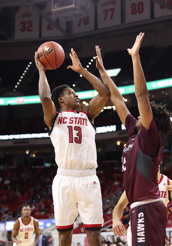 Redshirt junior guard C.J. Bryce attempts a shot from the paint in PNC Arena on Saturday, Nov. 10. Bryce went 4-4 on free throws as the Wolfpack won 95-49.