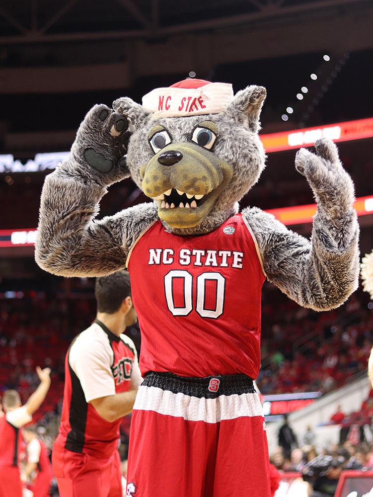 Mr. Wuf beckons the crowd to be louder in PNC Arena on Saturday, Nov. 10. The Wolfpack had 47 rebounds and 23 assists as they beat the Hawks 95-49.
