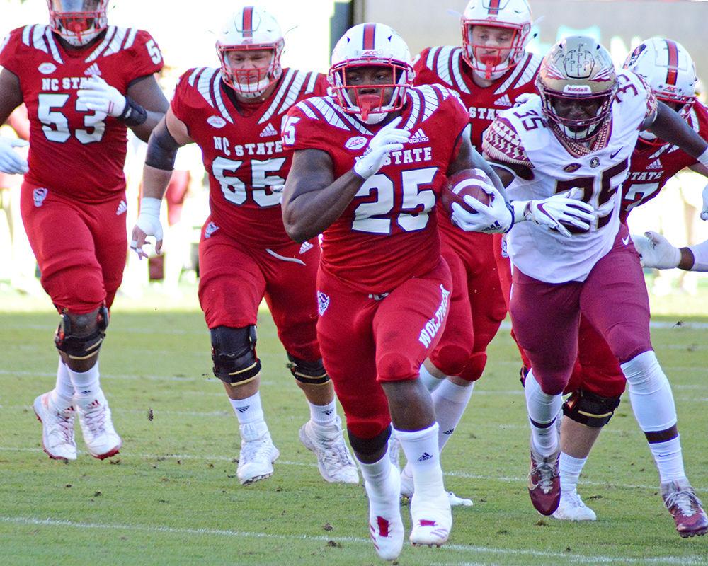 Senior running back Reggie Gallaspy Jr. carries the ball against Florida State on Saturday, Nov. 3 at Carter-Finley Stadium. Gallaspy totaled 106 yards on 21 carries as the Wolfpack won 47-28.