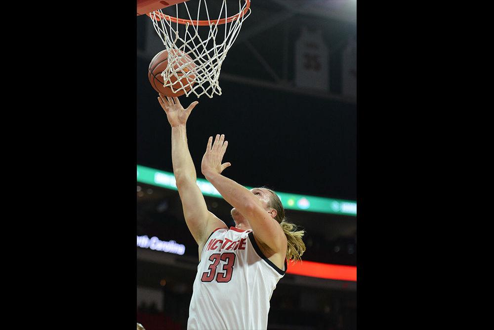 Graduate forward Wyatt Walker takes an inside shot against Chowan on Monday, Oct. 29, 2018 at PNC Arena. Walker recorded 5 rebounds, 4 assists, and a game-high 3 blocks as the Wolfpack won 111-62.