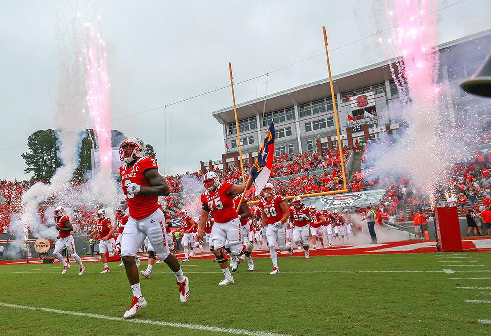 Graduate linebacker Germaine Pratt helps lead the team onto the field against Boston College on Saturday, Oct. 6 in Carter-Finley Stadium. Pratt had a major day with 1.5 tackles for a loss, one sack, and a forced fumble that he recovered. NC State survived a late Boston College resurgence for a 28-23 win.