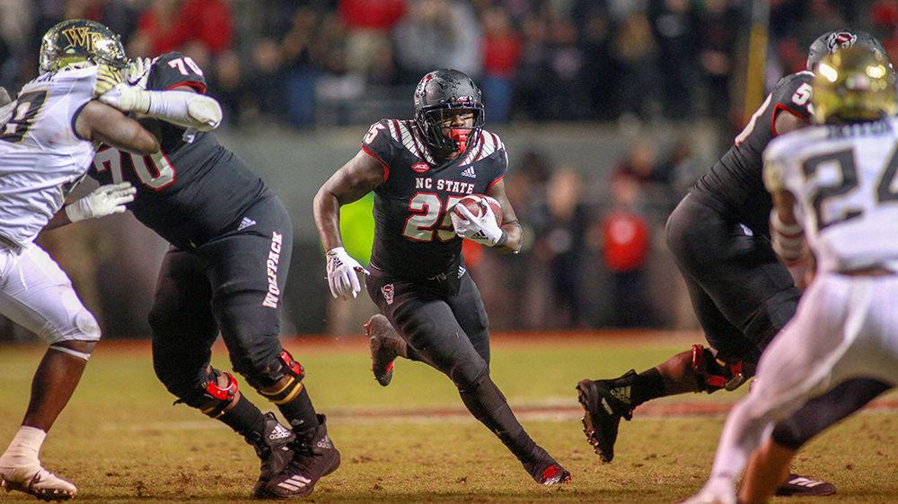 Senior running back Reggie Gallaspy Jr. finds a gap and sprints forward for a quick gain. Gallaspy had a team-high 36 yards during the 27-23 loss to Wake Forest on Thursday, Nov. 8 in Carter-Finley Stadium.