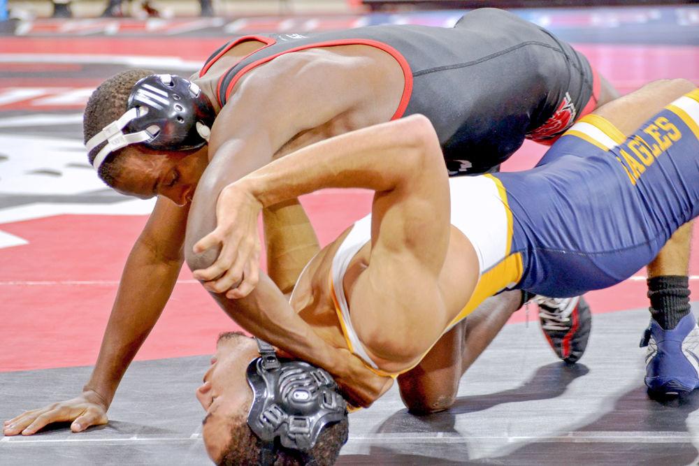 Redshirt freshman Tariq Wilson fights against Reinhardt on Saturday, Nov. 18, 2017 in Reynolds Coliseum. The Wolfpack beat the Eagles 54-0.
