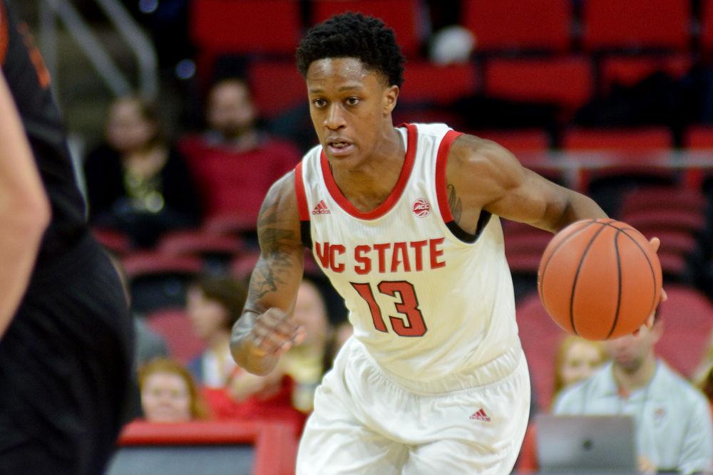 Redshirt junior guard C.J. Bryce dribbles up the court against Mercer on Saturday, Nov. 24 at PNC Arena. Bryce scored 17 points, surpassing 1,000 career points as the Wolfpack won 78-74.
