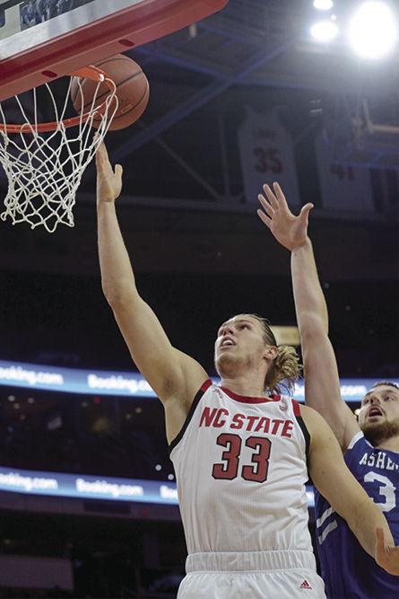 Graduate forward Wyatt Walker attacks the rim on Tuesday, Nov. 13 at PNC Arena. Walker scored 10 points on 5-8 shooting as the Wolfpack beat UNC-Asheville 100-49.