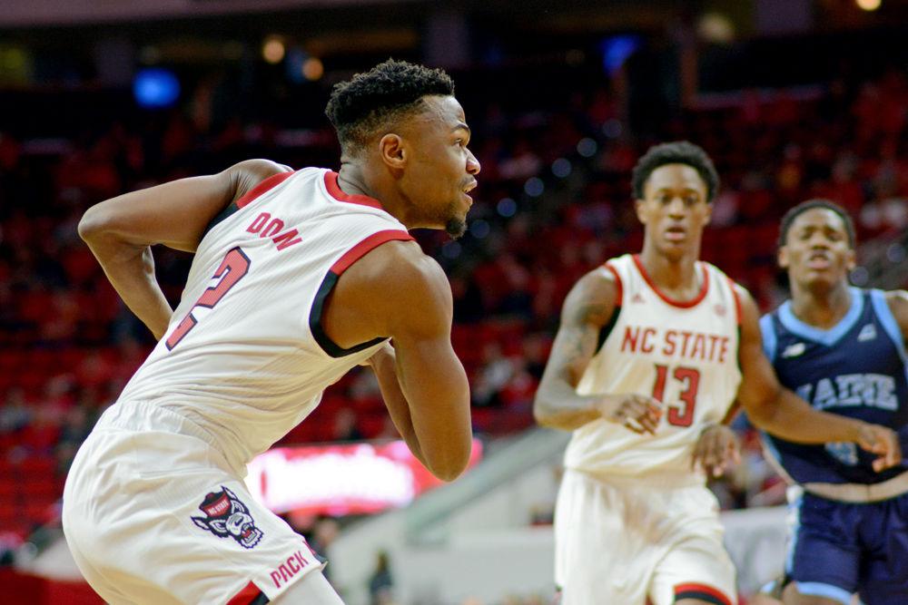 Redshirt senior guard Torin Dorn drives to the basket against Maine on Saturday, Nov. 17 at PNC Arena. Dorn recorded 15 total and five rebounds as the Wolfpack won 82-63.