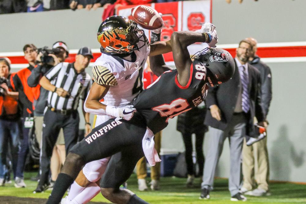 Wake Forest defensive back Amari Henderson breaks up a touchdown pass intended for sophomore wide receiver Emeka Emezie, the first of multiple missed touchdown opportunities for NC State on&#160;Thursday, Nov. 8 in Carter-Finley Stadium. Emezie totaled five receptions for 83 yards and one touchdown as the Wolfpack lost 27-23.
