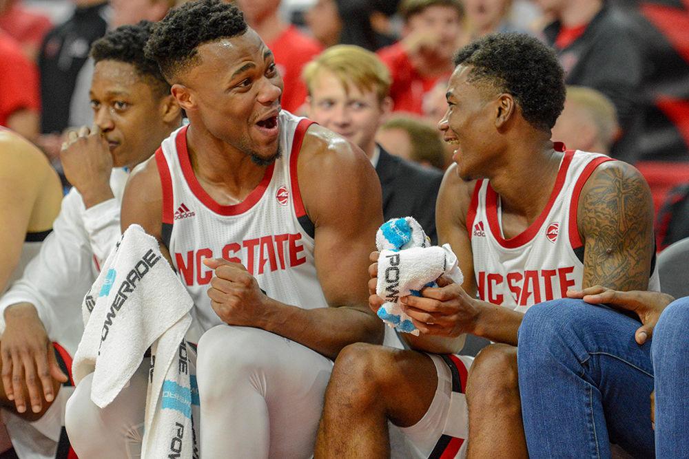 Redshirt senior guard Torin Dorn and junior guard Markell Johnson enjoy the large lead against Mount St. Mary's on Tuesday, Oct. 6 in PNC Arena. Dorn had a game-high 28 points against the Mountaineers as the Wolfpack won 105-55.