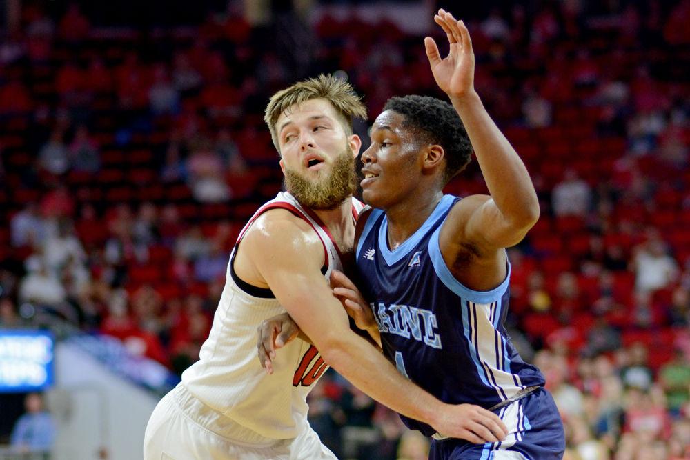 Sophomore guard Braxton Beverly defends Maine guard Terion Moss on Saturday, Nov. 17 at PNC Arena. Beverly went 2-8 on 3-point shots as the Wolfpack won 82-63.