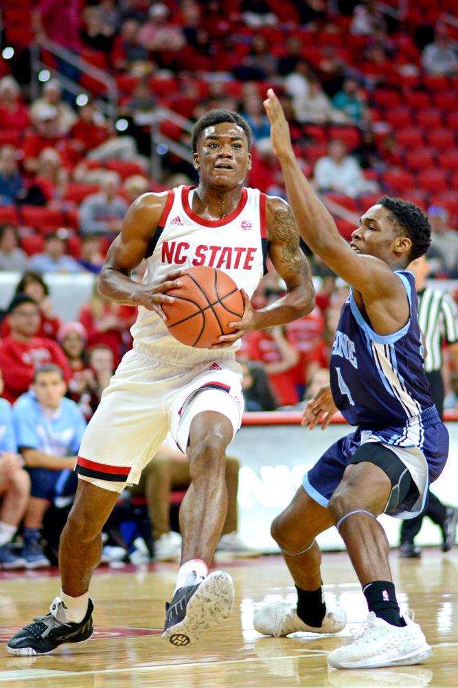 Junior guard Markell Johnson attacks the basket against Maine on Saturday, Nov. 17 at PNC Arena. Johnson recorded 13 points on 4-6 3-point shooting and one made free throw along with five assists as the Wolfpack won 82-63.&#160;