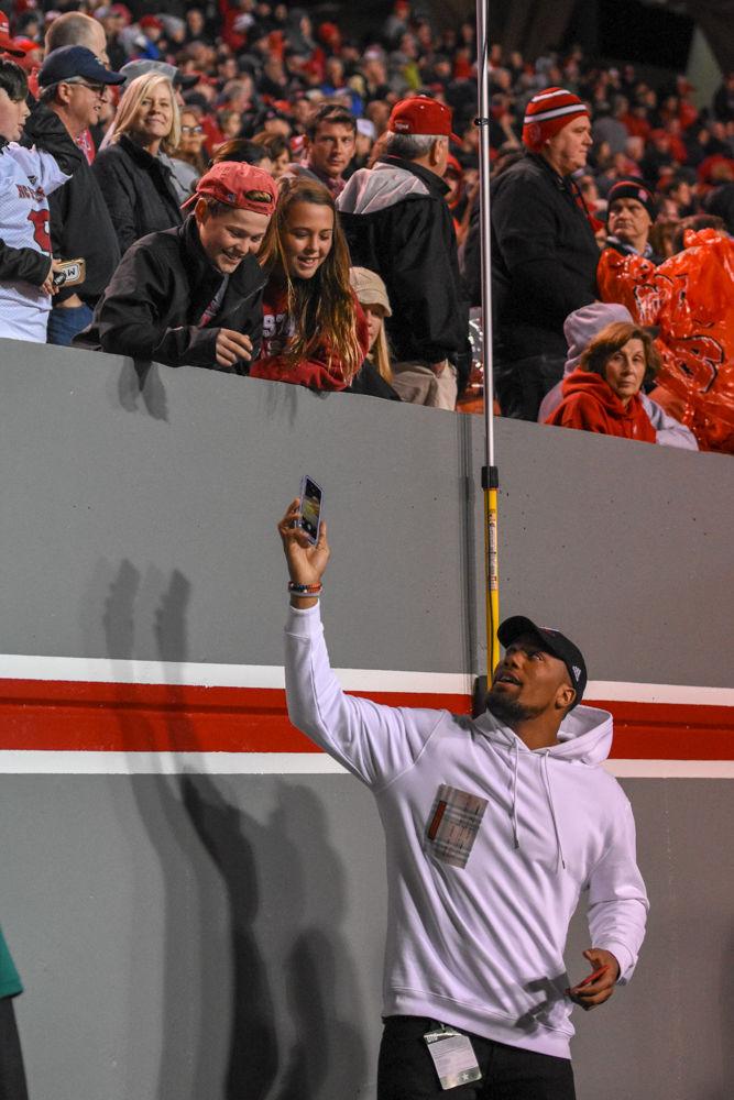 Denver Broncos linebacker and former Wolfpack defensive end Bradley Chubb takes a selfie with young fans at the game against Wake Forest on Thursday, Nov. 8. NC State lost 27-23.