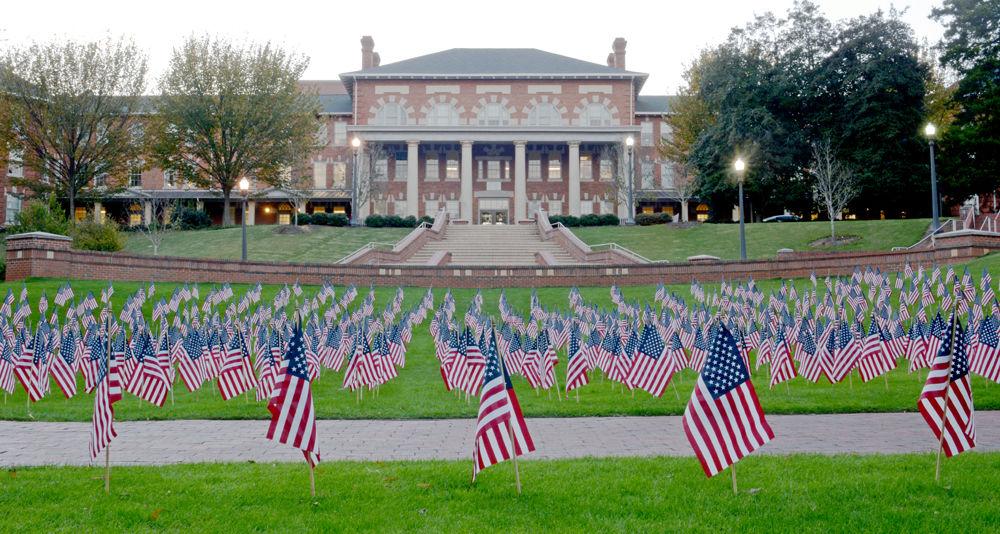 American flags dot the western end of the Court of North Carolina Monday evening on Nov. 3, 2014. The 1,191 flags, each representative of an NC State veteran, were placed on campus by the Student Veterans Association in celebration of Veterans Day.