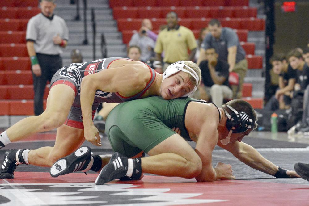 Redshirt freshman Hayden Hidlay takes down a Utah Valley opponent in Reynolds Coliseum on Saturday, Nov. 18, 2017. The Wolfpack beat Utah Valley 34-6, along with victories over UNC-Pembroke and Reinhardt.