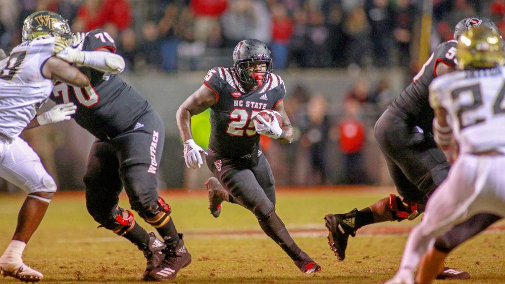 Senior running back Reggie Gallaspy Jr. finds a gap and sprints forward for a quick gain on Thursday, Nov. 8 in Carter-Finley Stadium. Gallaspy had a team-high 36 rushing yards during the 27-23 loss to Wake Forest.