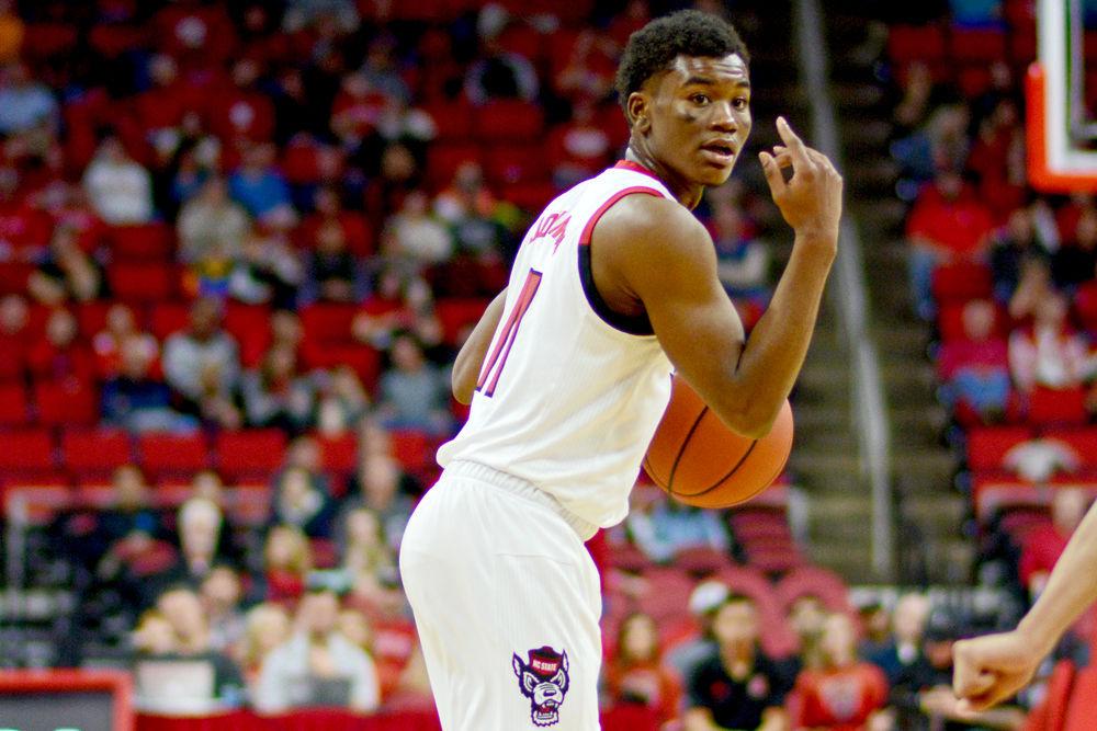 Junior guard Markell Johnson signals while handling the ball on Saturday, Nov. 24 at PNC Arena. Johnson scored 16 points on 6-10 shooting as the Wolfpack beat Mercer 78-74.