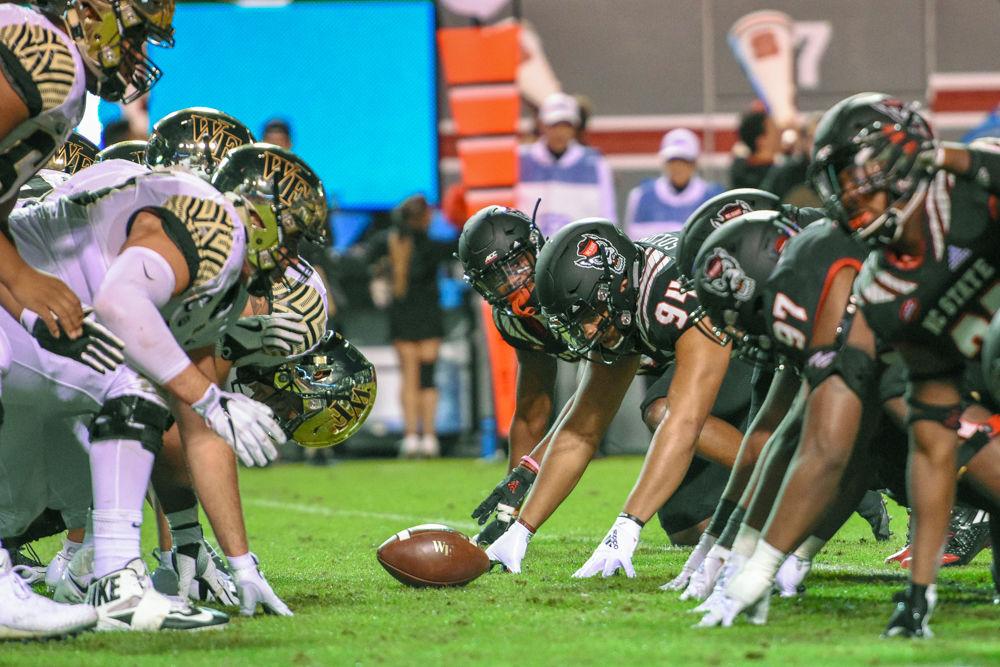 NC State's defense and Wake Forest's offense line up for a play on Friday, Nov. 8 in Carter-Finley Stadium. The Wolfpack lost 27-23.