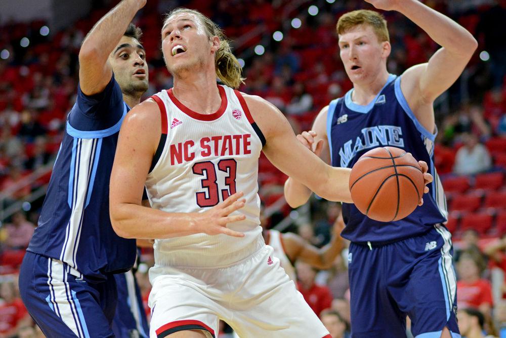 Graduate forward Wyatt Walker looks for an inside shot against Maine on Saturday, Nov. 17 at PNC Arena. Walker recorded 5 points and four rebounds as the Wolfpack won 82-63.