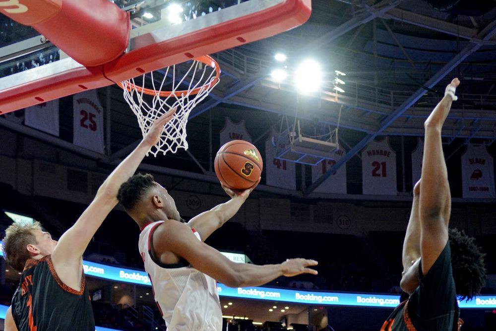Redshirt senior guard Torin Dorn attempts a dunk at against Mercer on Saturday, Nov. 24 at PNC Arena. Dorn scored 19 points as the Wolfpack won 78-74.
