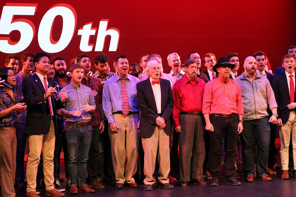Different generations of Grains of Time perform the NC State alma mater together at the 50th anniversary concert on Saturday, Dec. 1 at Talley Student Union.