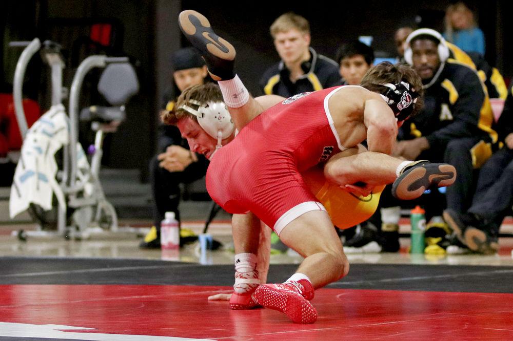 Redshirt freshman Zurich Storm takes down Appalachian State&#8217;s Andy Richard on Tuesday, Dec. 4 at Reynolds Coliseum. The Wolfpack won 29-9.