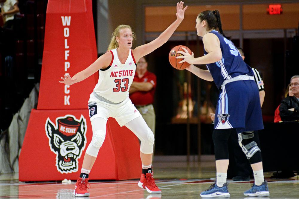 Freshman center Elissa Cunane defends Maine forward Kira Barra on Saturday, Dec. 15 at Reynolds Coliseum. Cunane recorded 11 points on 4-of-4 shooting along with eight rebounds as the Wolfpack won 84-46.