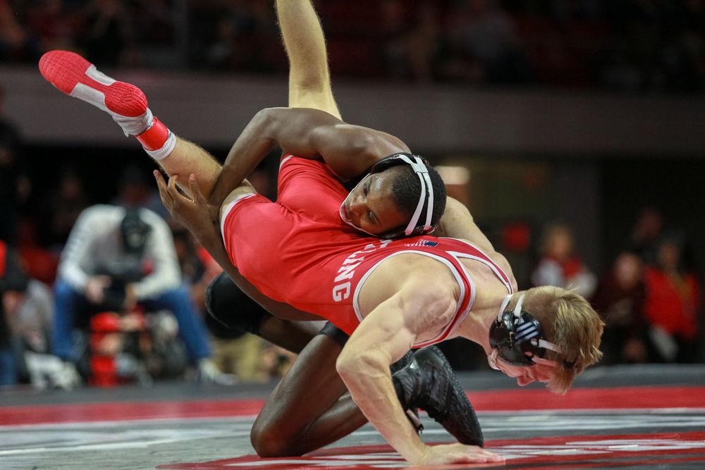 Redshirt sophomore Tariq Wilson, No. 4 in the 133 weight class, takes down Nebraska redshirt freshman Tucker Sjomeling. Wilson's bout was the last of the day and he won 19-2, enough for a technical fall, tying the team score at 17 apiece. The Wolfpack was awarded one more point for a 18-17 victory over No. 11 Nebraska on Sunday, Dec. 16 in Reynolds Coliseum.