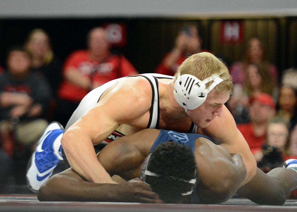 Redshirt freshman Hayden Hidlay takes down a UNC opponent on Feb. 9, 2018 at Reynolds Coliseum. The Wolfpack beat the No. 24 Tar Heels 26-7 to improve to 14-1 overall and 4-0 in the ACC.
