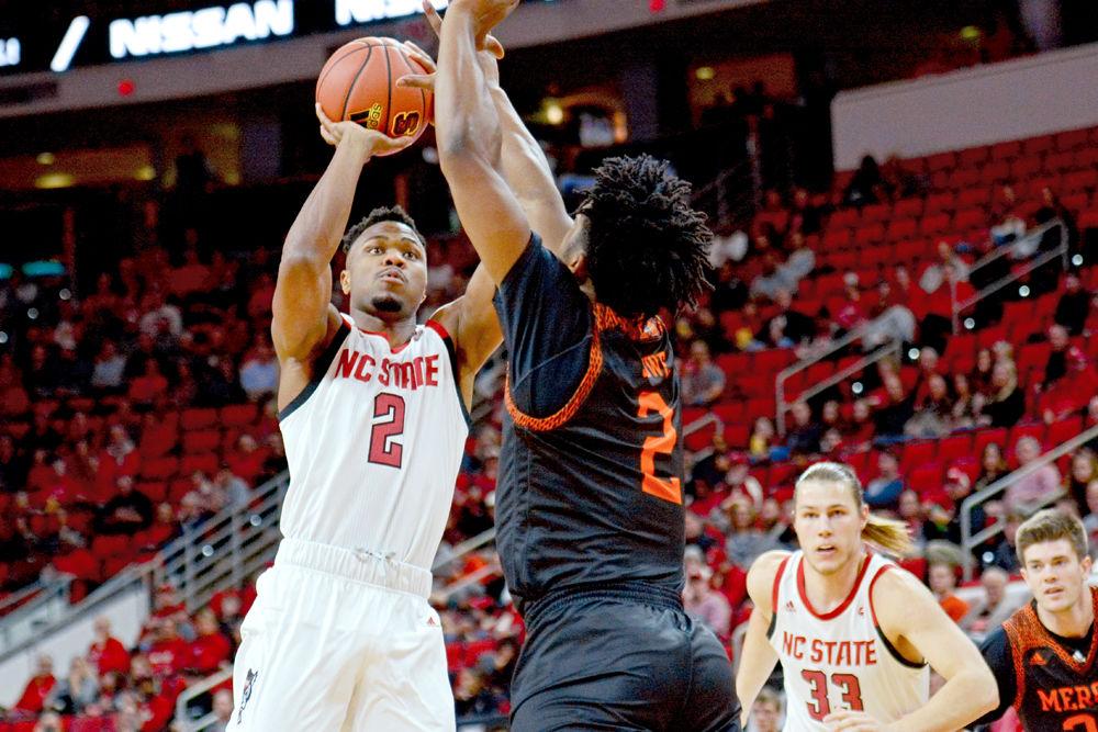 Redshirt senior guard Torin Dorn takes a shot on Saturday, Nov. 24 at PNC Arena. Dorn scored 19 points on 7-of-15 shooting along with nine rebounds as the Wolfpack beat Mercer 78-74.