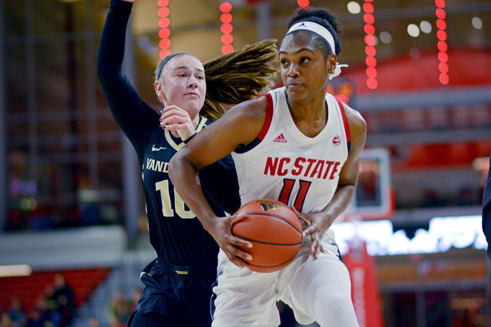 Graduate guard Kiara Leslie drives past Vanderbilt guard Cierra Walker&#160;on Thursday, Nov. 15 at Reynolds Coliseum. Leslie made a team-high 7 field goals out of 11 attempts as the Wolfpack defeated the Commodores 74-54.