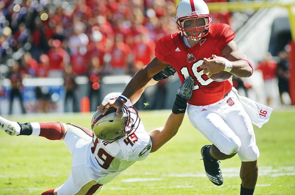 Redshirt junior quarterback Russell Wilson runs the ball against Boston College in Carter-Finley Stadium on Oct. 9, 2010. Wilson had total of 45 rushing yards during the game. NC State won against Boston College 44-17