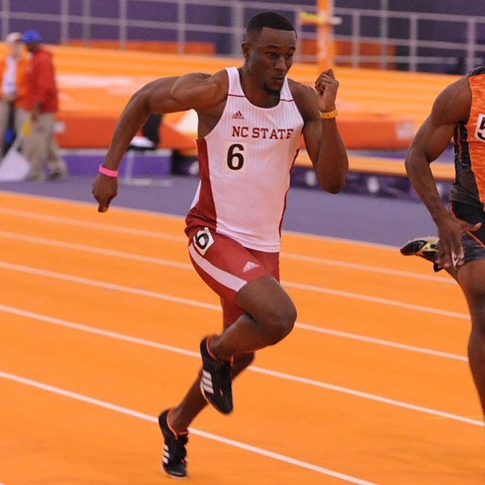 Cravont Charleston, a junior from Charlotte, sprints on a track.