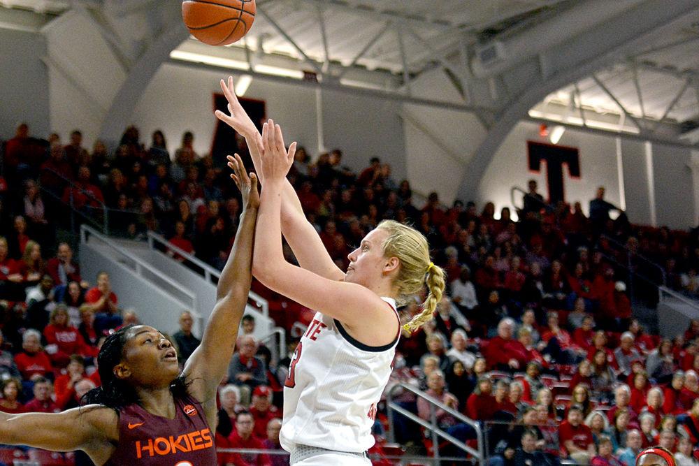 Freshman center Elissa Cunane attempts a shot against Virginia Tech on Sunday, Jan. 20 at Reynolds Coliseum. Cunane recorded 6 points and five rebounds in the Wolfpack's 70-61 overtime win.