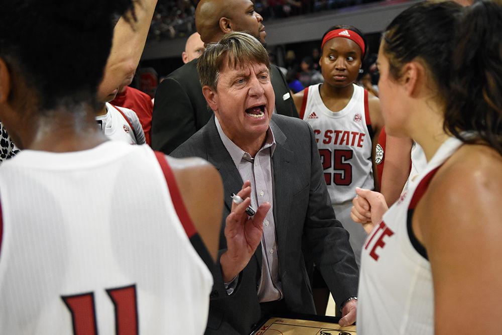 Head coach Wes Moore talks to his team during a timeout against Duke on Jan. 3 at Reynolds Coliseum. The Wolfpack won 63-51 in their first ACC game of the season.