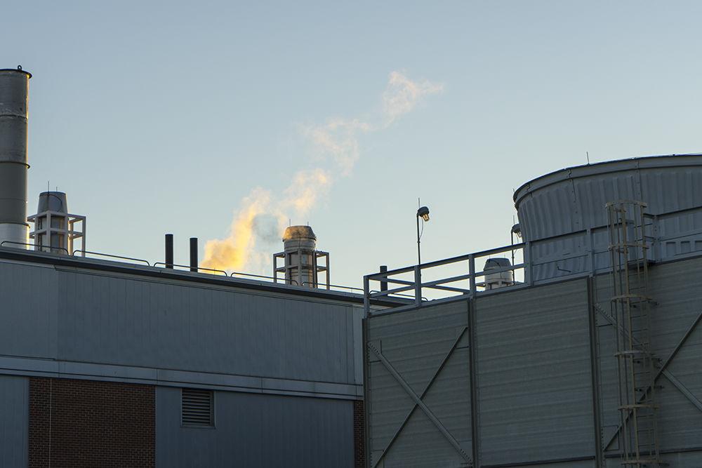 Steam rises out of the Centennial Campus Central Utility Plant. The facility provides electricity and steam for Centennial Campus.