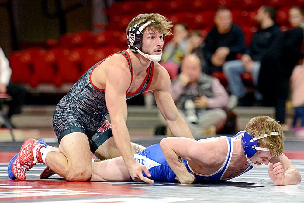 Redshirt freshman Zurich Storm reacts in relief after taking down Duke sophomore Harrison Campbell in the 125 weight class. Storm had a 19-4 technical fall win against Campbell. The No. 8 Wolfpack defeated Duke 30-12 on Friday, Jan. 25 in Reynolds Coliseum.