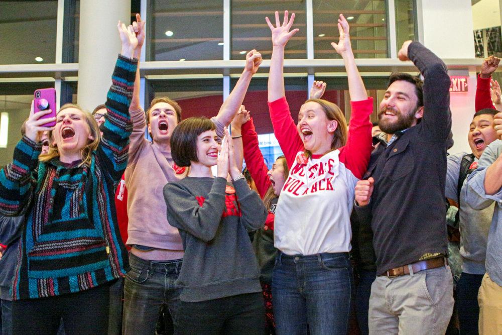 Vice President Meredith Spence Beaulieu, a fourth-year Ph.D. studying entomology, and Student Body President Jess Errico, a fourth-year studying mechanical and aerospace engineering, cheer with their campaign team at the announcement of their election on Thursday, March 1 in Talley Student Union.