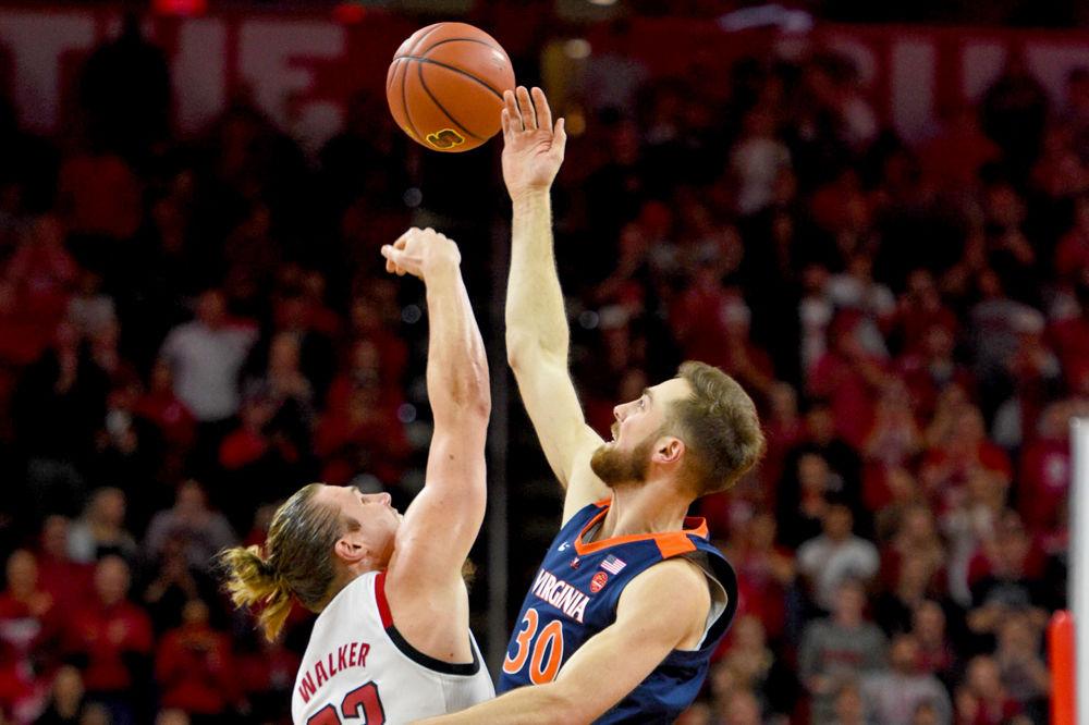 Graduate forward Wyatt Walker wins the tip-off against Virginia center Jay Huff at PNC Arena on Tuesday, Jan. 29. The Wolfpack suffered a close overtime loss to UVA 66-65. Walker recorded 11 points, 3 blocks and got 7 rebounds against the Cavaliers*.&#160;
*Editor's note: the caption has been updated to correct Virginia's nickname.