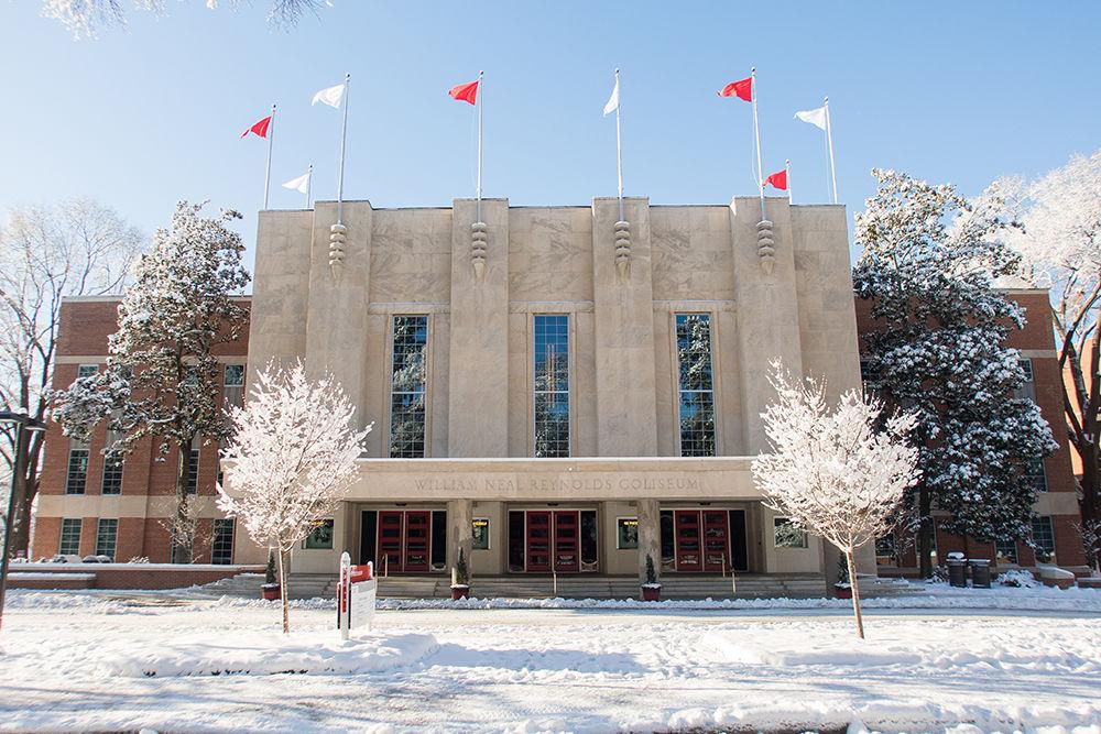 Snow blankets the ground in front of Reynolds Coliseum on Jan. 18, 2018. The snow started to accumulate the previous morning and caused classes to be canceled for several days.