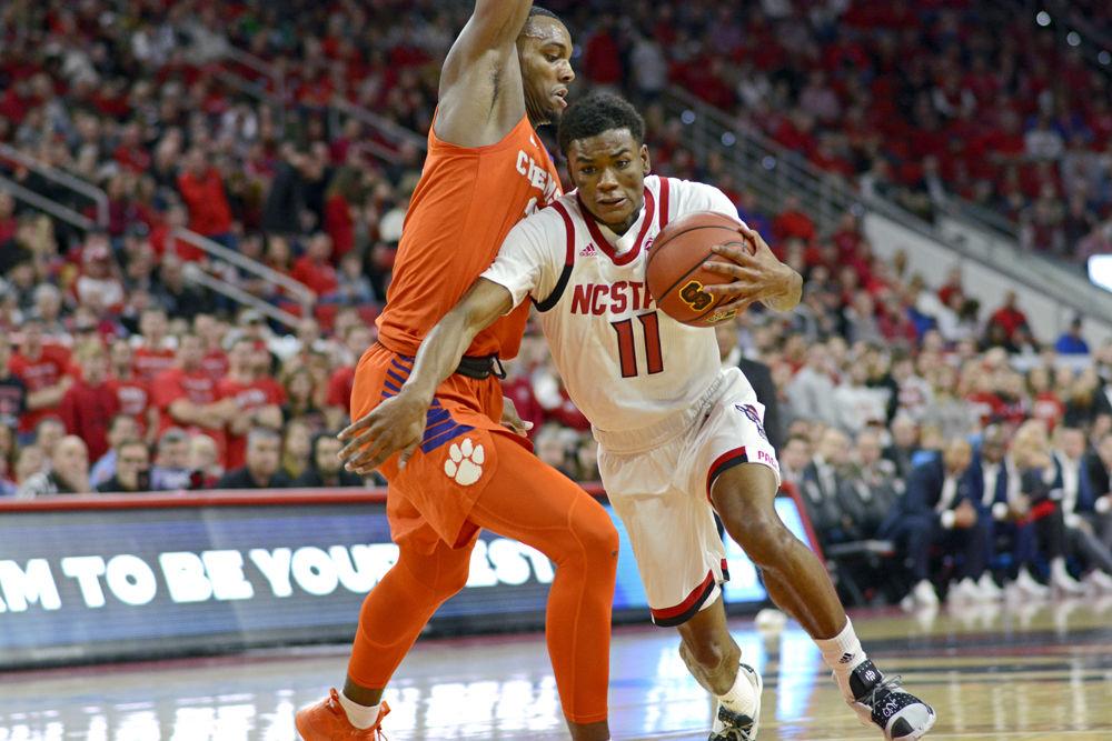 Junior guard Markell Johnson pushes past the Clemson defense to the basket on Saturday, Jan. 26 in PNC Arena. This was Johnson&#8217;s first game back after a hip injury. Johnson scored 16 points for the Wolfpack in their 69-67 win over the Tigers with a buzzer-beating 3-pointer by sophomore guard Braxton Beverly.