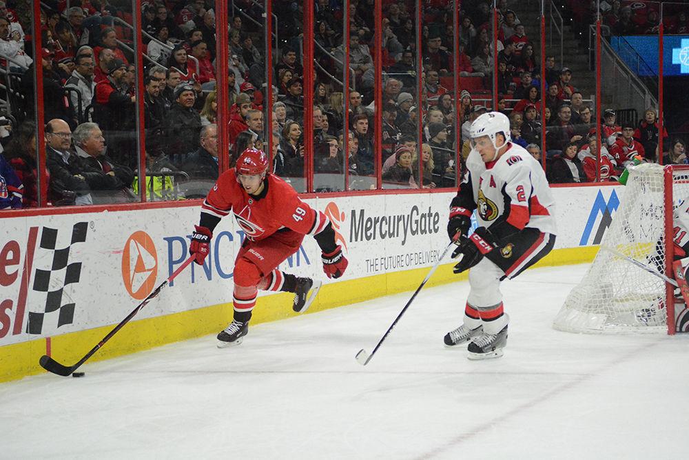 Hurricanes center Victor Rask moves the puck away from a Senators defender during the game at PNC Arena. Canes beat the Senators with a score of 2-1 on Tuesday, Jan. 30. The Canes are currently 5th in the Metropolitan Division.