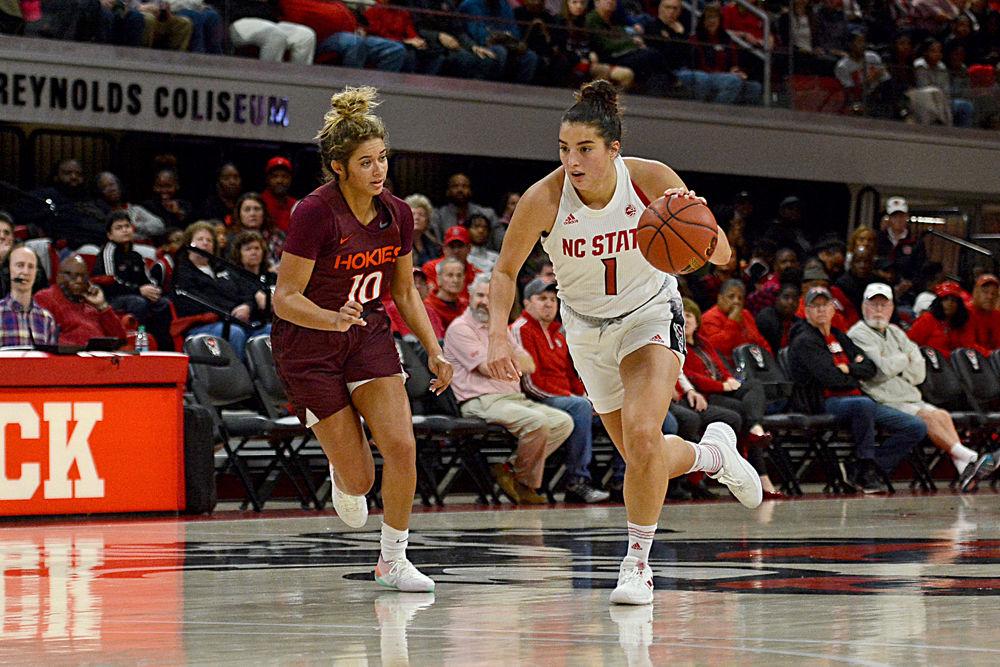 Junior guard Aislinn Konig dribbles by Virginia Tech guard Kendyl Brooks on Sunday, Jan. 20 at Reynolds Coliseum. Konig scored 20 points in the Wolfpack's 70-61 overtime win.