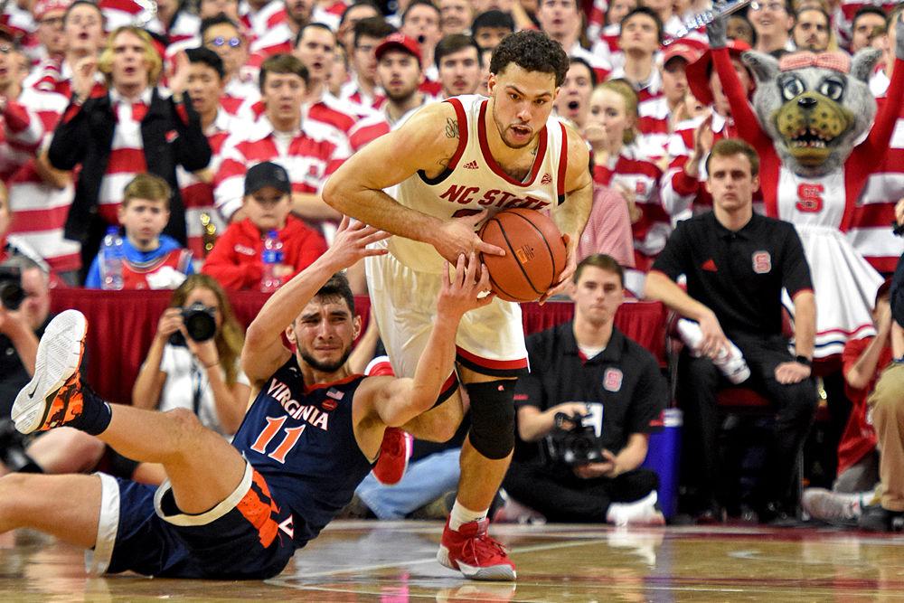 Redshirt sophomore guard Devon Daniels steals the ball from Virginia guard Ty Jerome at PNC Arena on Tuesday, Jan. 29. Daniels scored 10 points in the Wolfpack's 66-65 overtime loss.