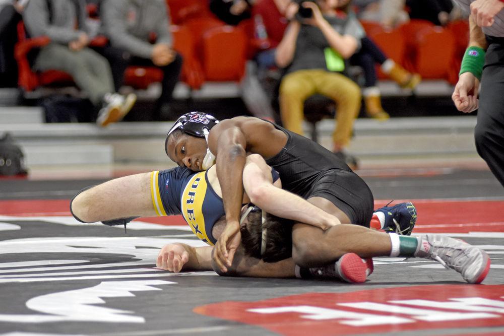 Redshirt senior Jamel Morris wrestles Drexel junior Nick Widmann during the dual on Saturday, Jan. 19, 2019 at Reynolds Coliseum. The Wolfpack beat the Dragons 25-16.