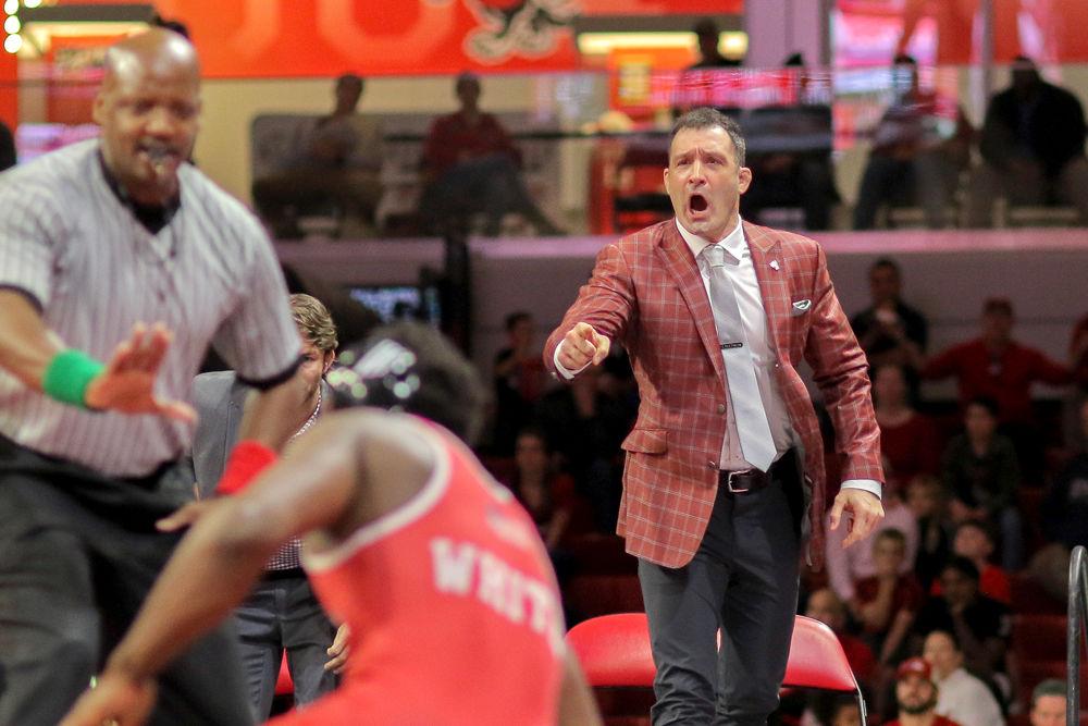 Head coach Pat Popolizio yells for the referee to re-center play. The No. 7 Wolfpack defeated No. 11 Nebraska by tying the score in the last bout on Sunday, Dec. 16 in Reynolds Coliseum. The Wolfpack won 18-17.